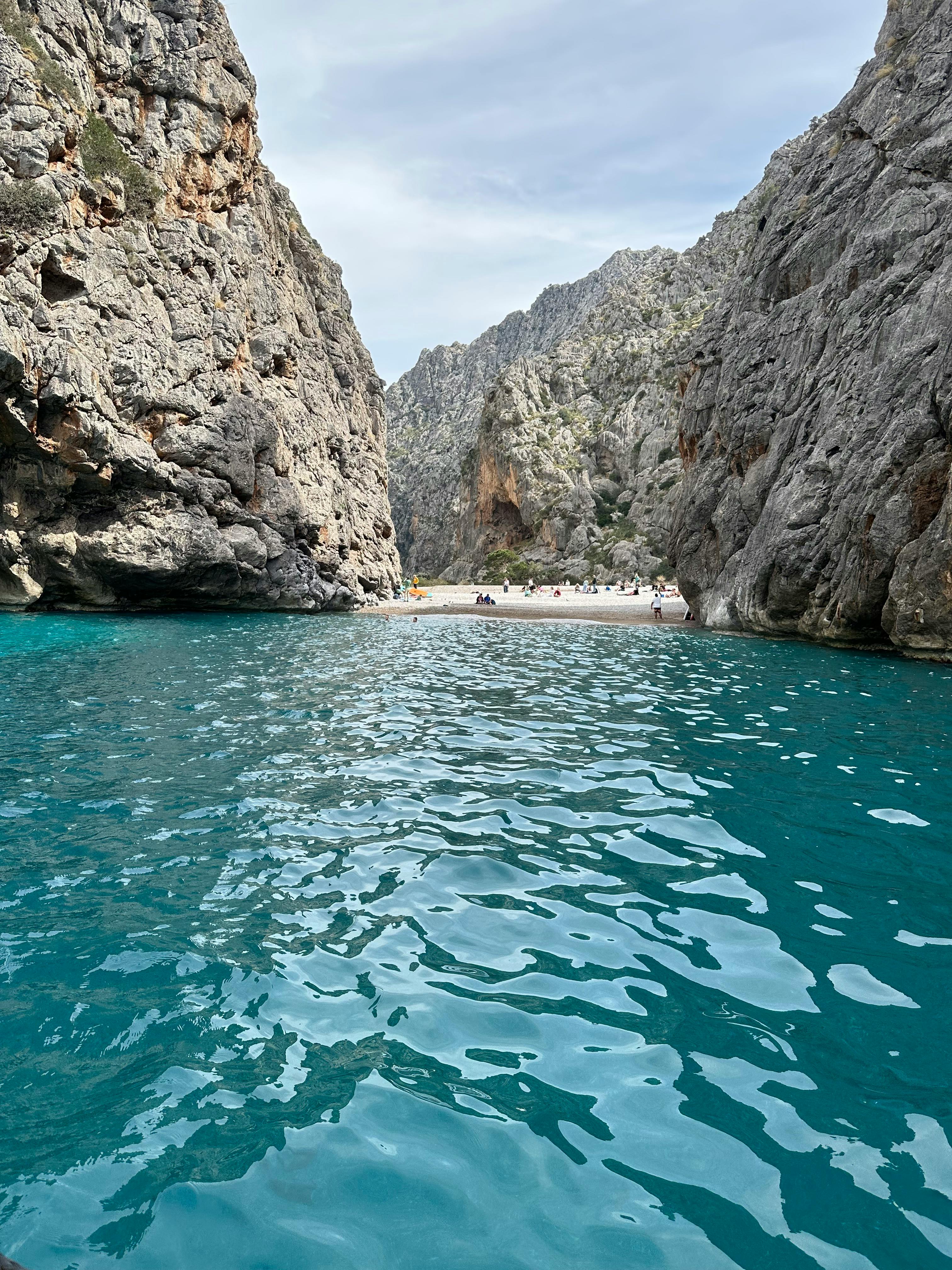 Sa Calobra, shooting spot for Cloud Atlas Movie. Beautiful Shot of the canyon and beach. Turqoise water, people at the beach in the distant.